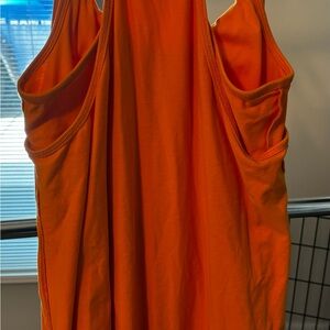 Orange pullover skort dress with spaghetti straps. small size. 2 patch pockets